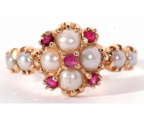 14ct gold seed pearl and ruby cluster ring, the cluster with four small pearls highlighted with five small round cut rubies w