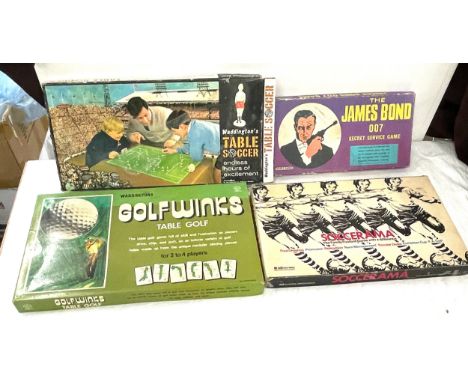 Selection of vintage board games to include Waddingtons table soccer, Waddingtons golf winks game, The James Bond 007 secret 