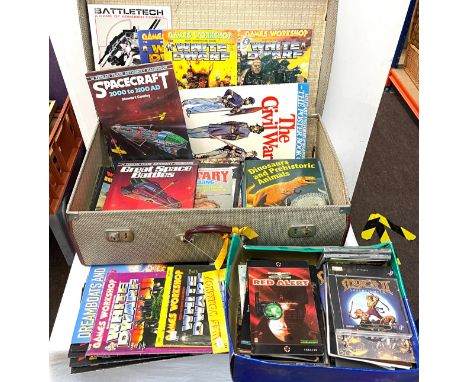 Vintage suitcase containing vintage computer games, magazines including White Dwarf, Work games illustrated 