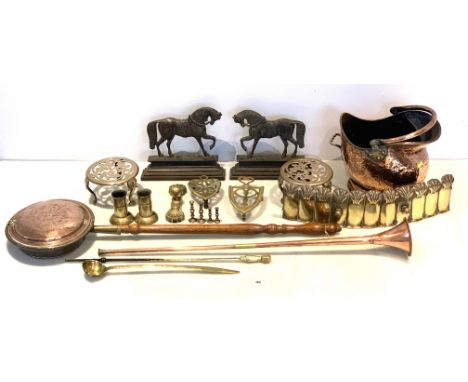 Assorted brassware inc. Coal bucket, trivets, hunting horn, bedpan, poker, ladle, shell vases, horse doorstops, fender etc.