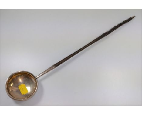 A George III silver toddy ladle.  London 1741.  With whale bone handle. 