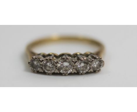 A Five Stone Diamond Ring. Size M.  Approx 3.46 gms 