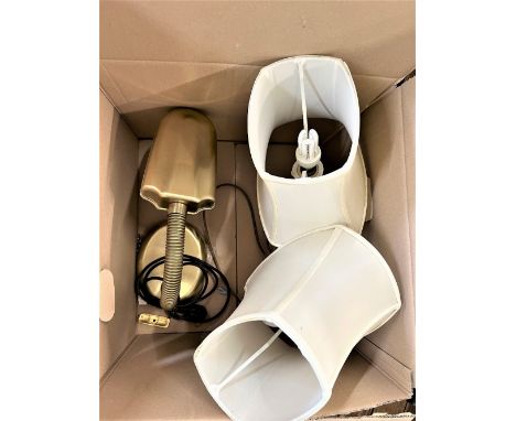A brass angled poised lamp and two brass column lamps. 