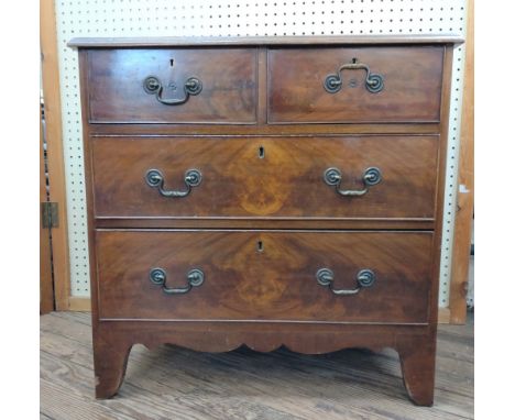 A George III Mahogany Chest of Drawers. Comprising two short and two long graduated drawers. On bracket feet. 