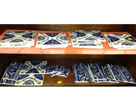 Eighteen ceramic wall tiles and fifteen edge panels. (33) 