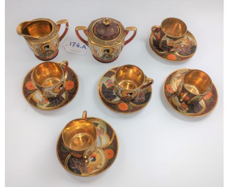 A Japanese Samurai China part tea service, comprising milk jug, sucrier, five cups (one with old glue repair) and five saucer