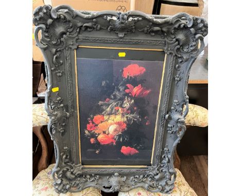 A Victorian carved plaster frame enclosing a still life print 