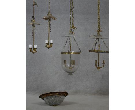 A pair of vintage French brass hanging ceiling lights, a similar pair, one with glass dome and a brass and glass light fittin