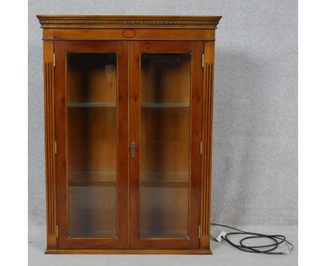A Georgian style inlaid yew wood bookcase section fitted with interior light. H.99.5 W.74 D.27cm 