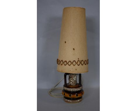 A vintage West German pottery table lamp with fat lava glaze and its original woven shade. H.78cm (Including shade) 