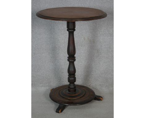A Victorian mahogany lamp table on turned pedestal platform base. H.72 D.52cm 