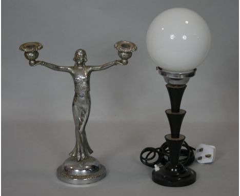 An Art Deco chrome figural two branch candelabra along with an Art Deco globe lamp on bakelite base. H.40cm 