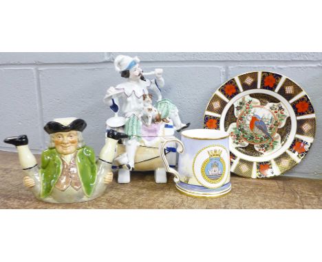 A continental figural tobacco barrel, a/f, a Tony Wood teapot, a Spode Ark Royal commemorative mug and a Royal Crown Derby li