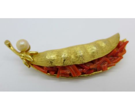 A vintage designer brooch with coral and cultured pearl signed "Capri"