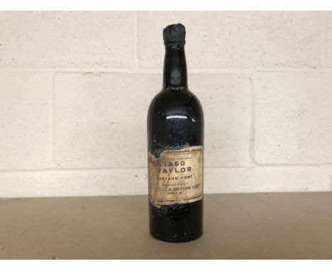 TAYLORS 1960 VINTAGE PORT
Oporto, Portugal. No capacity or strength stated. CONDITION REPORT: Capsule has come away, but cork