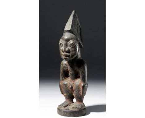 West Africa, Nigeria, Yoruba peoples, ca. early 20th century CE. A male Ere Ibeji figure, standing at attention with arms at 