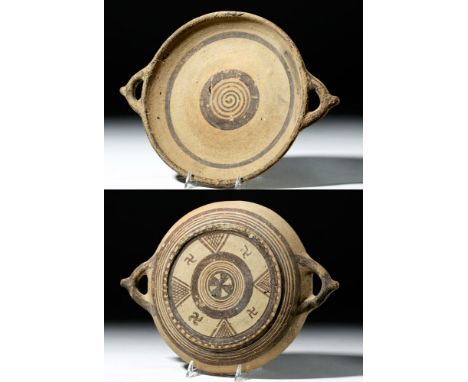 Ancient Greek, Cyprus, Cypro-Archaic Period, ca. 750 to 500 BCE. A round, shallow terracotta plate with twin loop handles pro