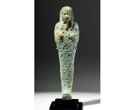Egypt, Third Intermediate Period, ca. 1070 to 712 BCE. An ushabti (shabti) of pale blue and green faience with five lines of 