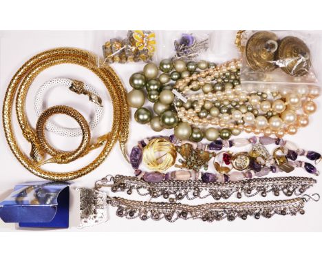 A collection of costume jewellery including a snake belt, bangle and ring 