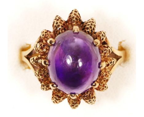 A vintage 9ct gold and cabochon amethyst dress ring, London 1970, textured claws, 18 x 14mm, O 1/2, 5.1gm 