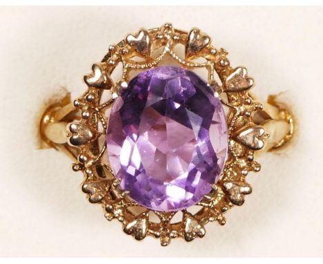 A vintage 9ct gold and amethyst dress ring, Birmingham 1972, with heart and rope border, 18 x 16mm overall, O, 5.3gm 