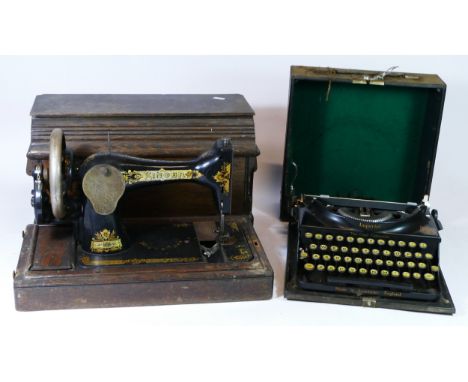 An early 20th century portable manual Singer sewing machine, together with an early portable Imperial typewriter. (2) 