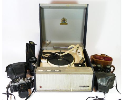 A Garrard portable record player, together with a Canon AE-1 35mm camera, a Super Paragon PMC II LENS, a Coronet camera and a