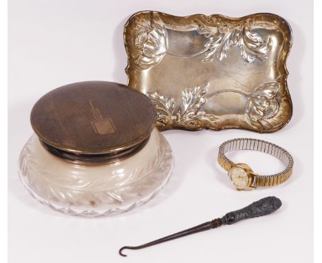 A silver pin tray, by Deakin &amp; Francis, Birmingham 1973, with embossed poppy decoration, 13 x 9cm, 68gm, together with a 