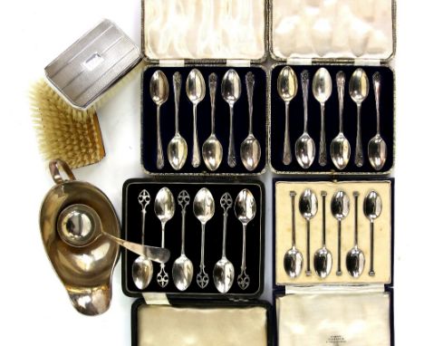 Silver items including cased sets of teaspoons, a cased clothes-brush set, sauce ladle and a sauce boat, weighable silver 10 