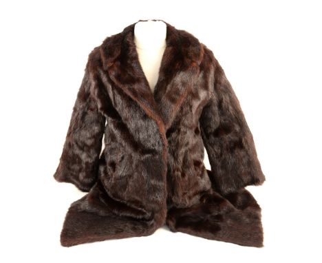 A mink fur coat and a long white coat with black collar, a mink stole, wrap an cape, ermine collar and two mink tail, and oth