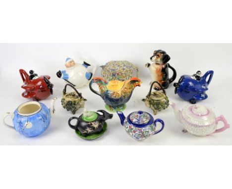 Grimwades Rooster teapot, Belleek Neptune shell teapot, Carlton Ware teapots in the form of a skier and two as aeroplanes and