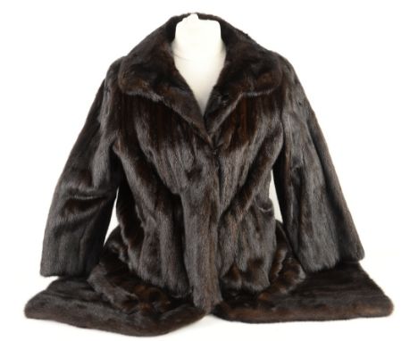 A mink full length coat and a fur wrap.     