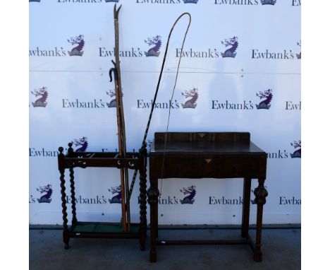 Umbrella stand with barley twist legs, a console table, and a collection of shepherds crooks,whip etc.     