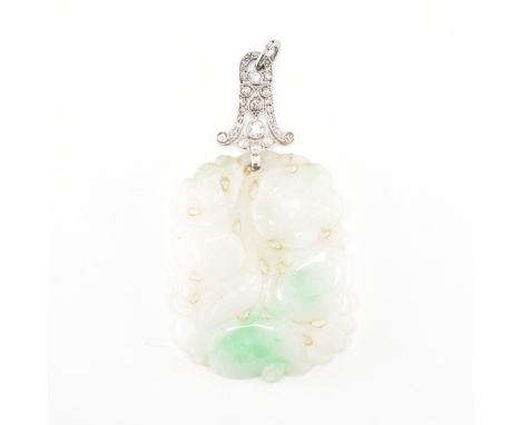 A 1920's Art Deco carved jade and diamond pendant necklace. The pendant being carved with florals and fruits with pierced det
