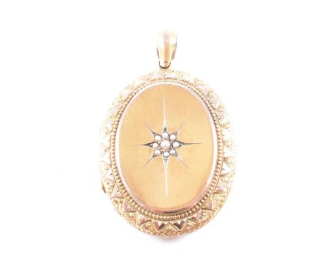 A Victorian pearl and yellow metal locket necklace pendant. The locket of oval form having a cluster of star set pearls to th