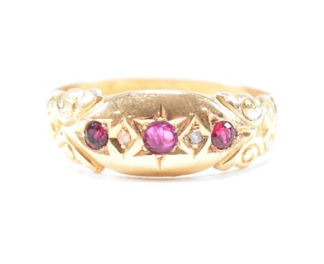 An antique 18ct yellow gold, ruby and diamond dome ring. The five stone gypsy style ring having a central round cut star set 