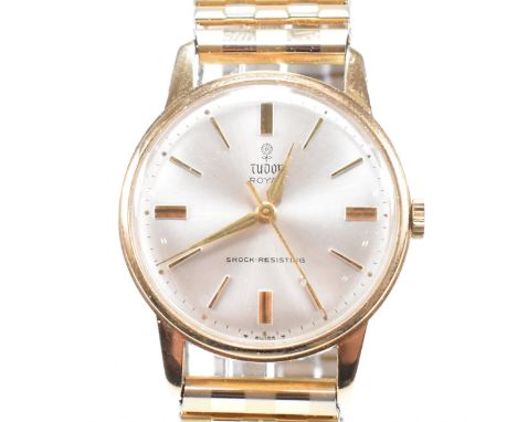A Tudor Royal ( Rolex ) 9ct gold wristwatch. The watch with champagne dial and baton numerals, dial marked Tudor Royal Shock 