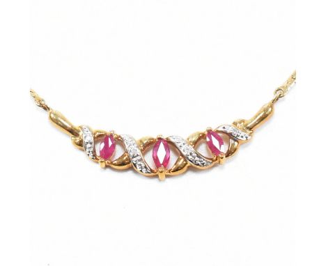 A hallmarked 9ct gold and ruby and diamond pendant necklace. The necklace presented in fitted case. Weight approx 5.8g. Measu
