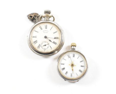 A 935 silver fob watch and an Ingersoll Midget metal pocket watch. The fob watch having a white enamel face with goldwork dec