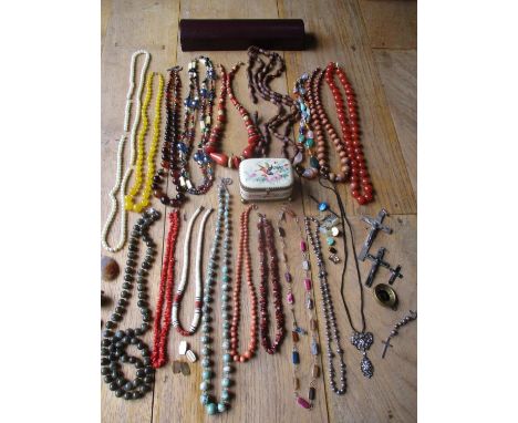 A quantity of vintage fashion jewellery to include hardstone, glass and treen bead necklaces, a red coral necklace, gold plat