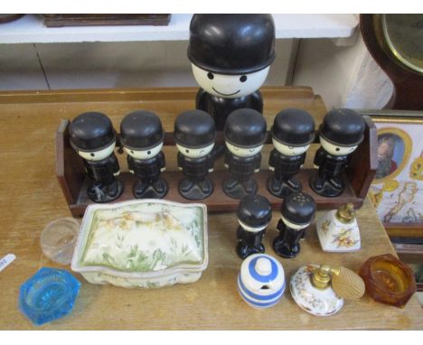 A selection of vintage Home Pride 'Fred' figures within a wooden spice rack and others together with a small quantity of glas