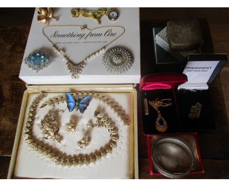 A 1950's Trifari gold tone and faux pearl jewellery set in a Ciro of Bond Street box, a French Sharmaine gold plated with blu