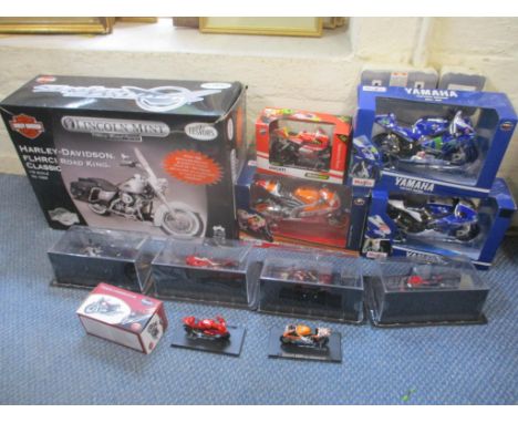 Eleven new diecast motorbikes, together with a Harley Davidson motorbike model kit 