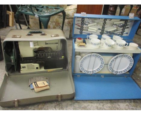 A vintage picnic set together with a Bernina sewing machine 