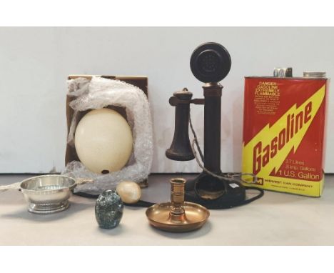 A mixed lot to include a candlestick telephone A/F, an American Gasoline 1 US gallon tin, an Ostrich egg, a brass candlestick