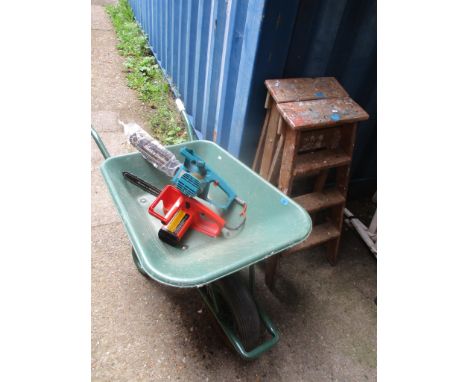 A wheelbarrow, together with two Black &amp; Decker chainsaws and two vintage folding ladders 