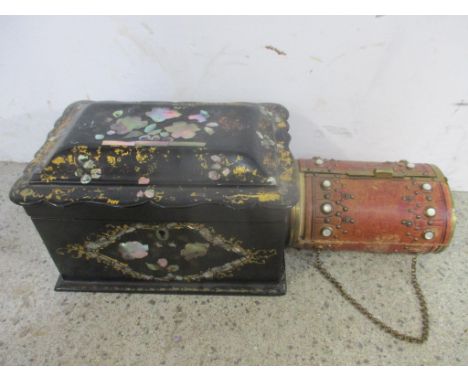 A Victorian black lacquered paper mache and mother of pearl tea caddy and a 19th century needle case 