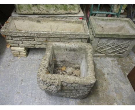Three garden stoneware planters to include a trough planter raised on two bases 31cm h x 75cm w Location: G 