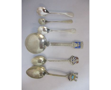 Three silver salt spoons, a Norwegian enamel spoon, a Torquay silver enamel spoon and a Stonehaven enamel spoon 