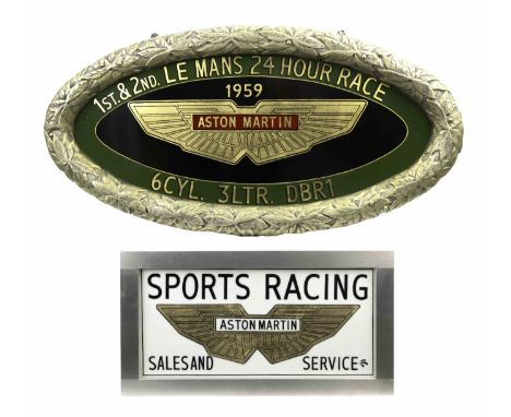 A hand-painted 'Aston Martin DBR1 1959 Le Mans' celebratory oval plaque and an 'Aston Martin' light box sign,both modern, the